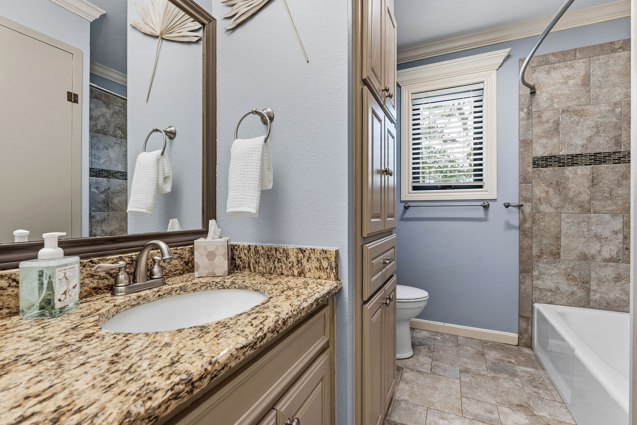 4601 Creek Ridge Austin, TX 78735 - Photo 24 of 40 Full bath with ornamental molding, vanity, shower / bathtub combination, and stone finish flooring