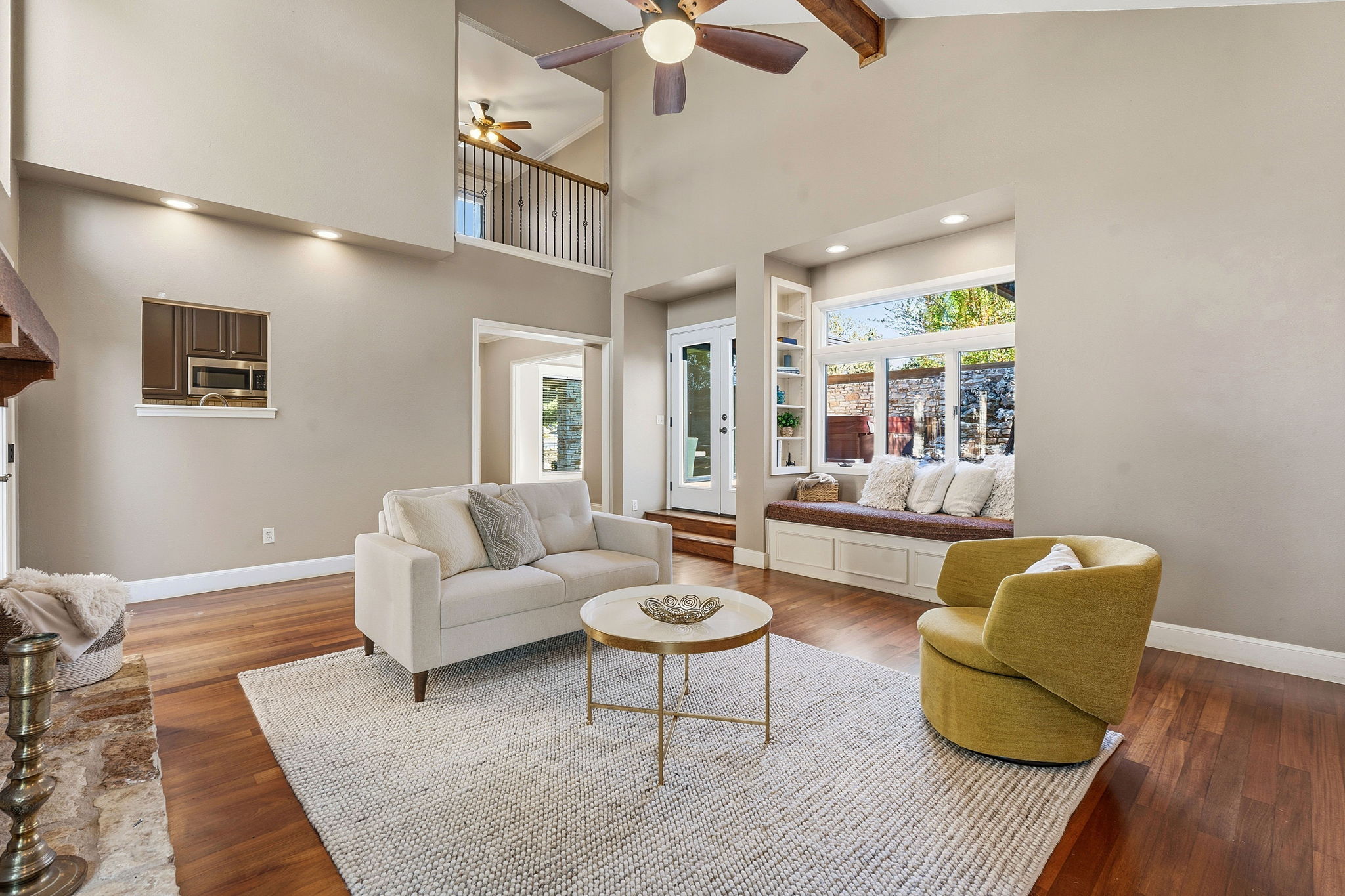 4601 Creek Ridge Austin, TX 78735 - Photo 7 of 40 Living room featuring a ceiling fan, recessed lighting, dark wood finished floors, plenty of natural light, and built in features