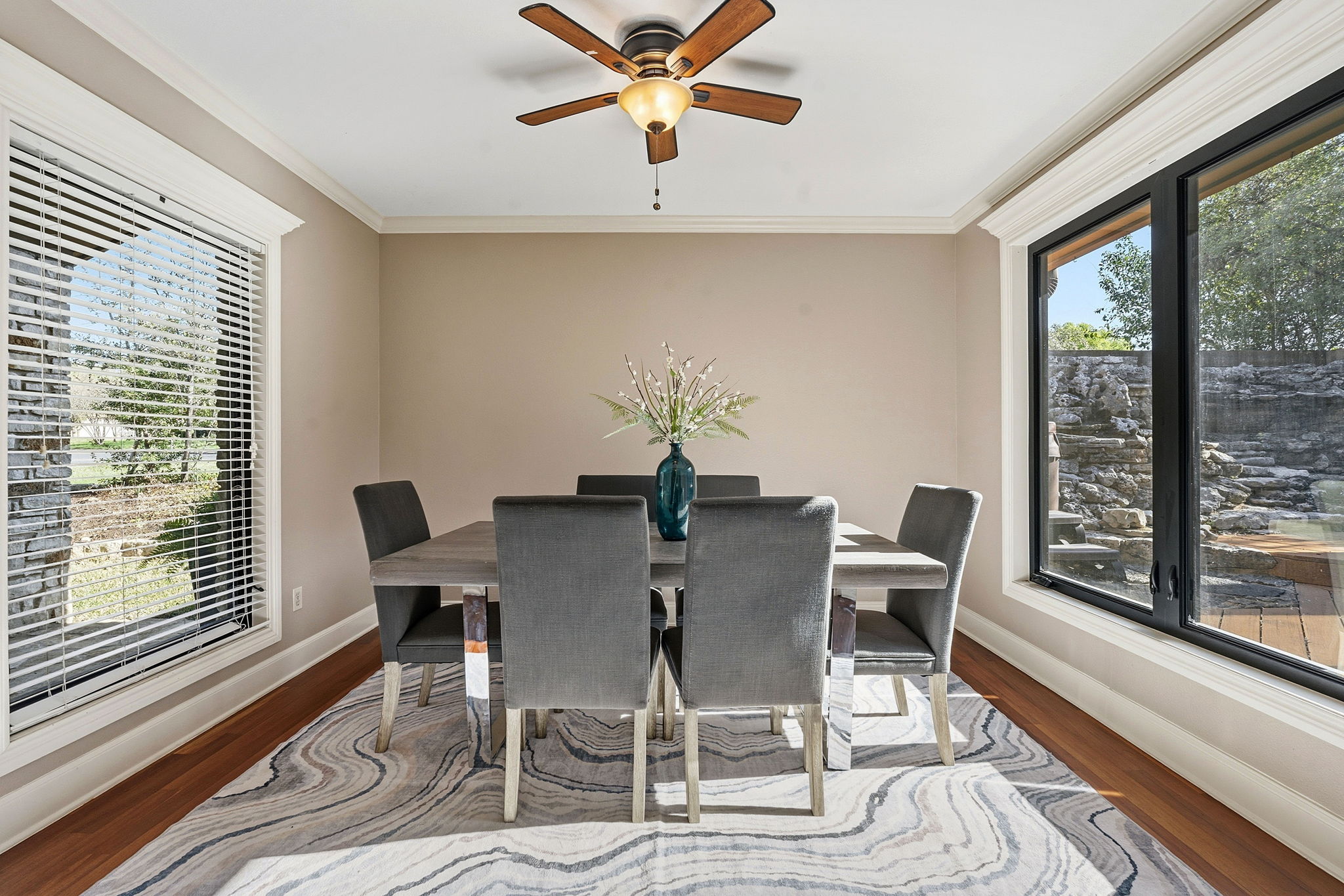 4601 Creek Ridge Austin, TX 78735 - Photo 10 of 40 Dining room featuring ornamental molding, ceiling fan, and light wood-style flooring