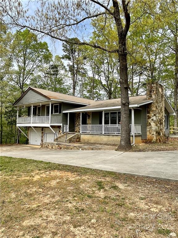 911 Long Branch Road Grover, NC 28073 - Photo 1 of 37 a front view of a house with swimming pool