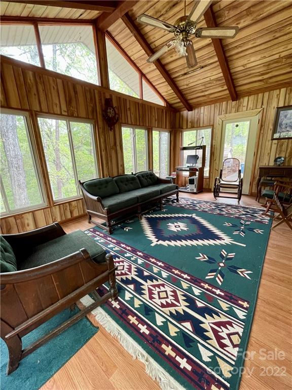 911 Long Branch Road Grover, NC 28073 - Photo 11 of 37 a living room with a bed a flat screen tv and a large window