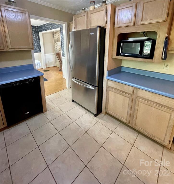 911 Long Branch Road Grover, NC 28073 - Photo 17 of 37 a kitchen with granite countertop a refrigerator and a stove top oven