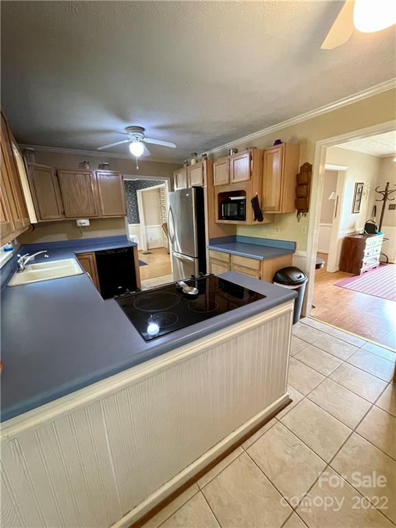 911 Long Branch Road Grover, NC 28073 - Photo 19 of 37 a kitchen with stainless steel appliances a sink and a stove