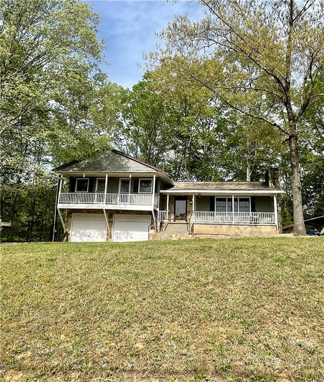 911 Long Branch Road Grover, NC 28073 - Photo 2 of 37 a front view of a house with a garden