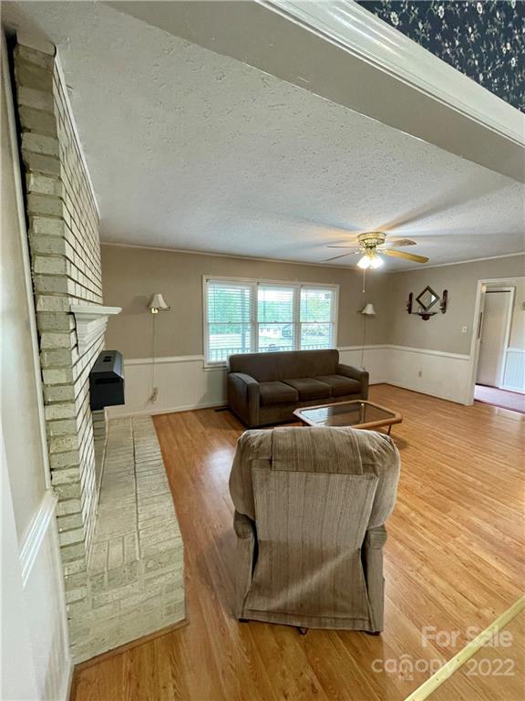 911 Long Branch Road Grover, NC 28073 - Photo 24 of 37 a living room with furniture and a wooden floor