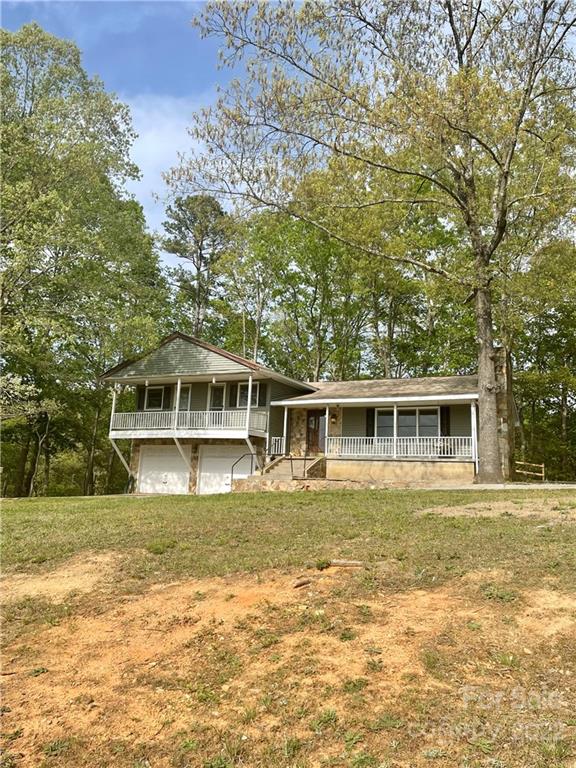 911 Long Branch Road Grover, NC 28073 - Photo 5 of 37 a front view of a house with a garden