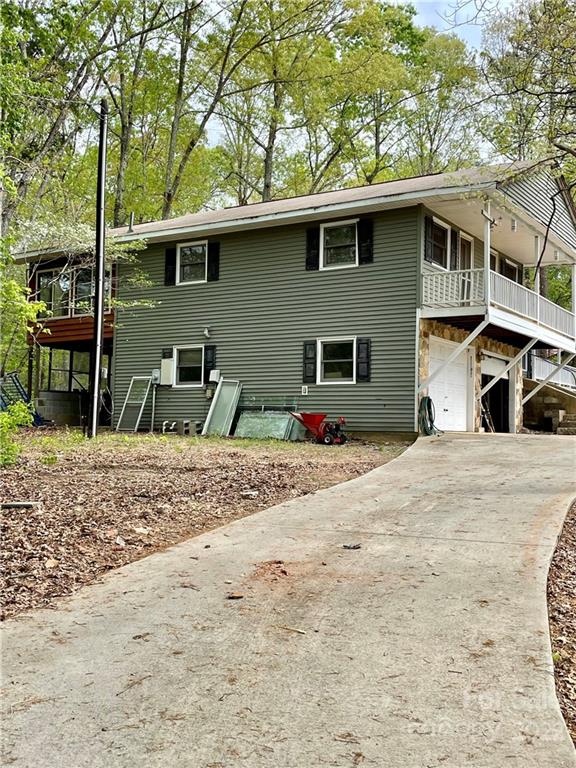 911 Long Branch Road Grover, NC 28073 - Photo 7 of 37 a front view of a house with garden