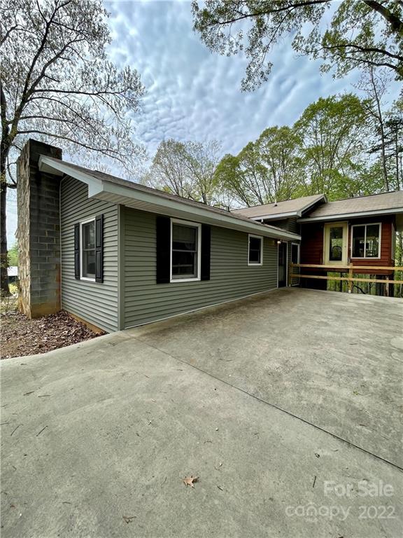 911 Long Branch Road Grover, NC 28073 - Photo 8 of 37 a front view of a house with garden
