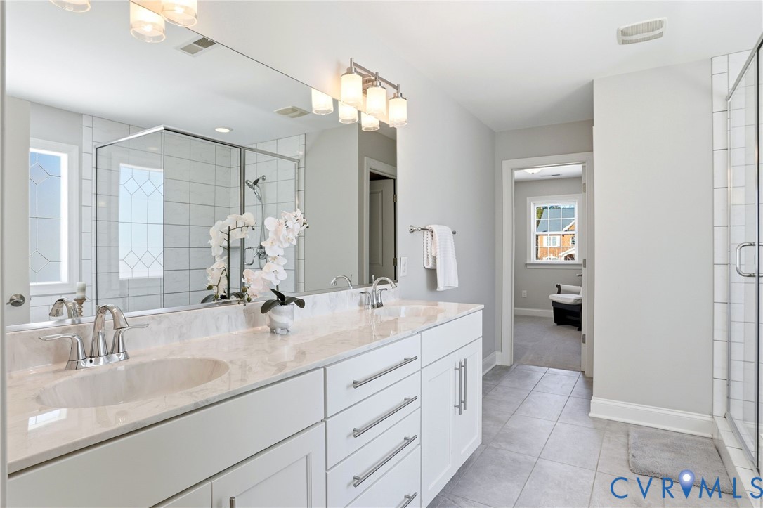 12050 Cameron Creek Road Glen Allen, VA 23059 - Photo 17 of 36 a en suite bathroom with double sink and a mirror
