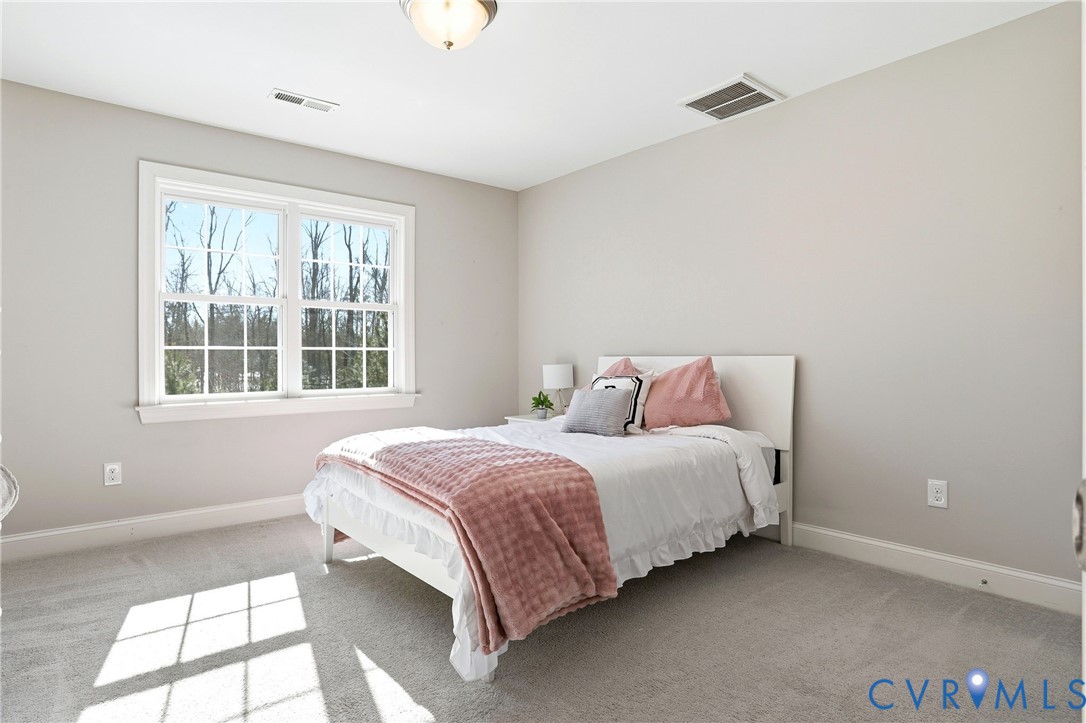 12050 Cameron Creek Road Glen Allen, VA 23059 - Photo 24 of 36 a bedroom with a bed and a window