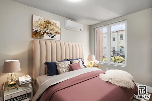 a bedroom with bed and a window