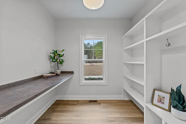a bathroom with a granite countertop sink a shower and a mirror