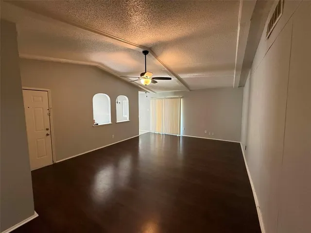a view of a livingroom with wooden floor