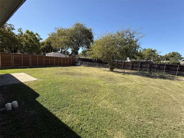 a swimming pool with wooden fence