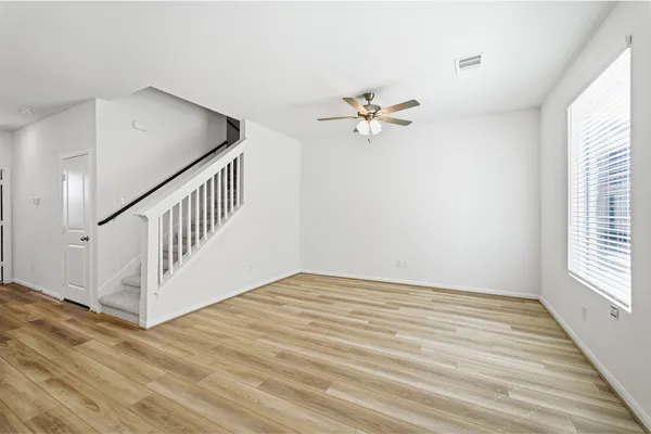 a kitchen that has a sink and a refrigerator