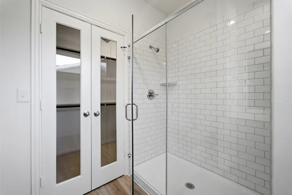 a bathroom with a shower and a sink
