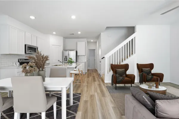 a view of kitchen with sink microwave and stove