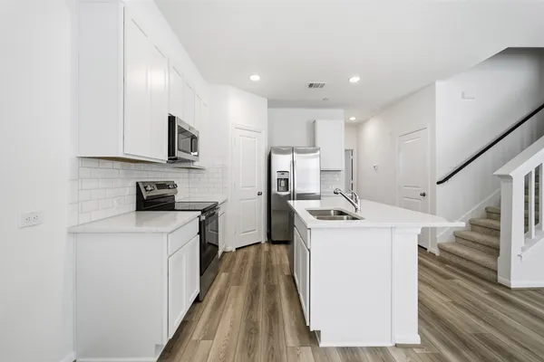 a view of kitchen with dining table and chairs