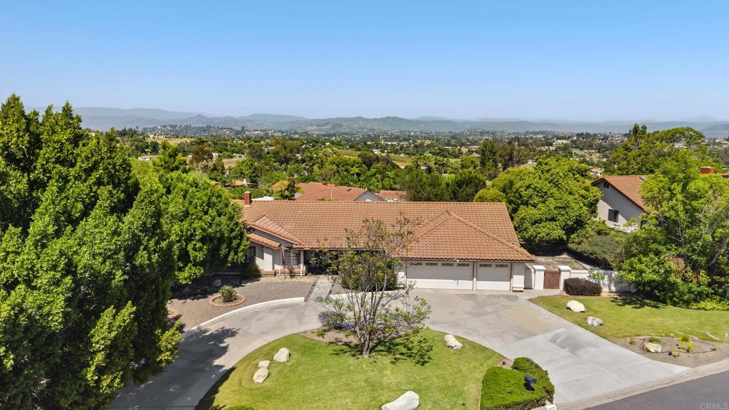 an aerial view of a house with a garden