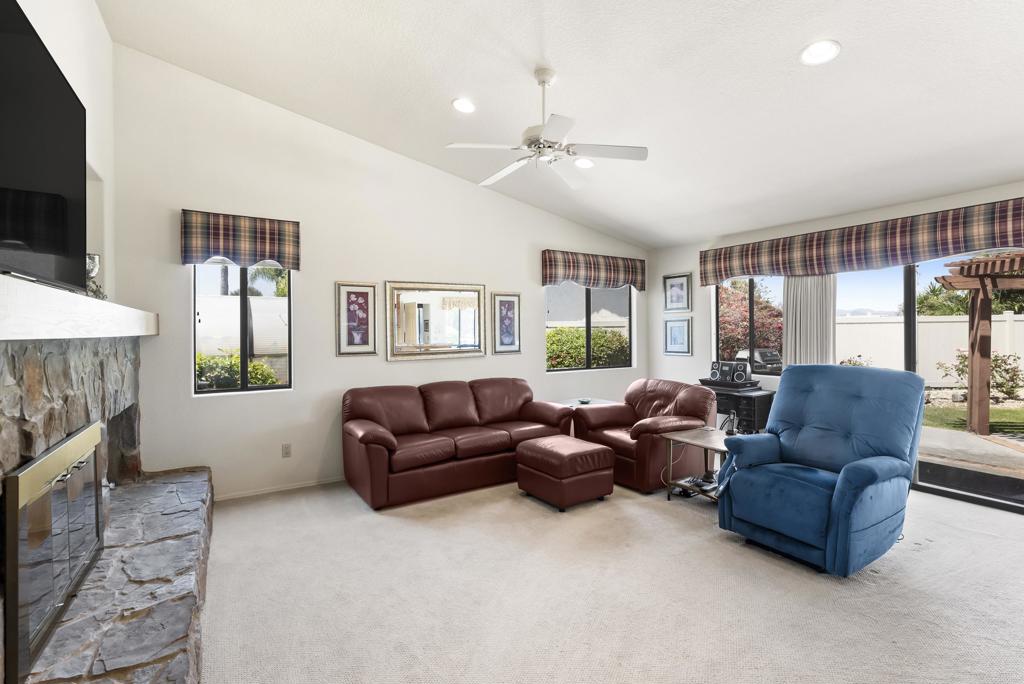 2221 Cortina Circle Escondido, CA 92029 - Photo 11 of 36 a living room with furniture and a large window