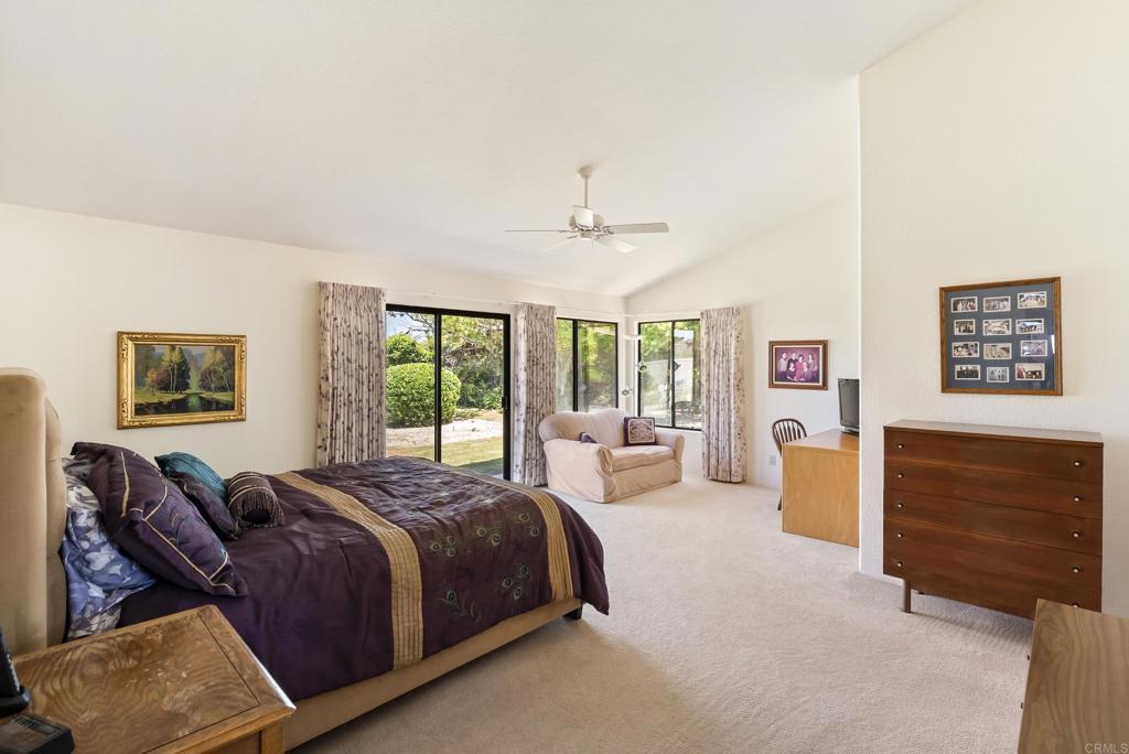 2221 Cortina Circle Escondido, CA 92029 - Photo 15 of 36 a spacious bedroom with a bed and dresser