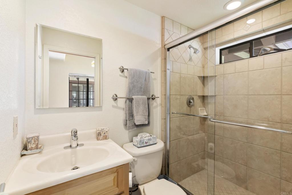 2221 Cortina Circle Escondido, CA 92029 - Photo 21 of 36 a bathroom with a toilet sink and shower