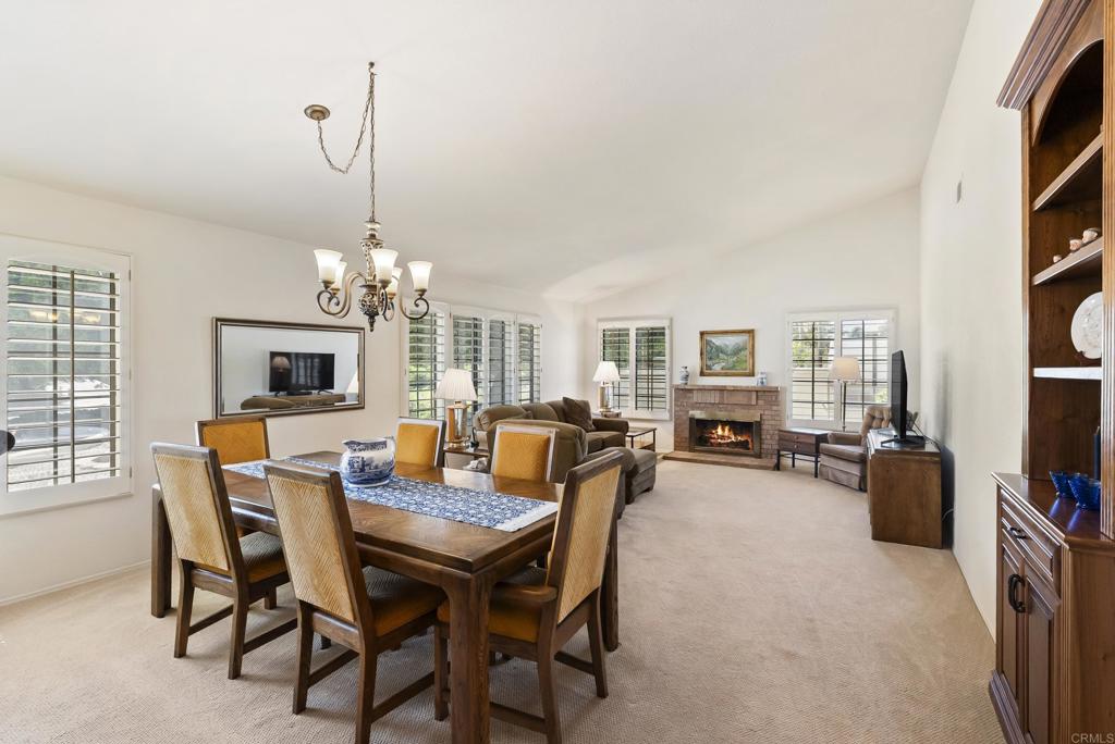 2221 Cortina Circle Escondido, CA 92029 - Photo 5 of 36 a view of a dining room with furniture and a chandelier