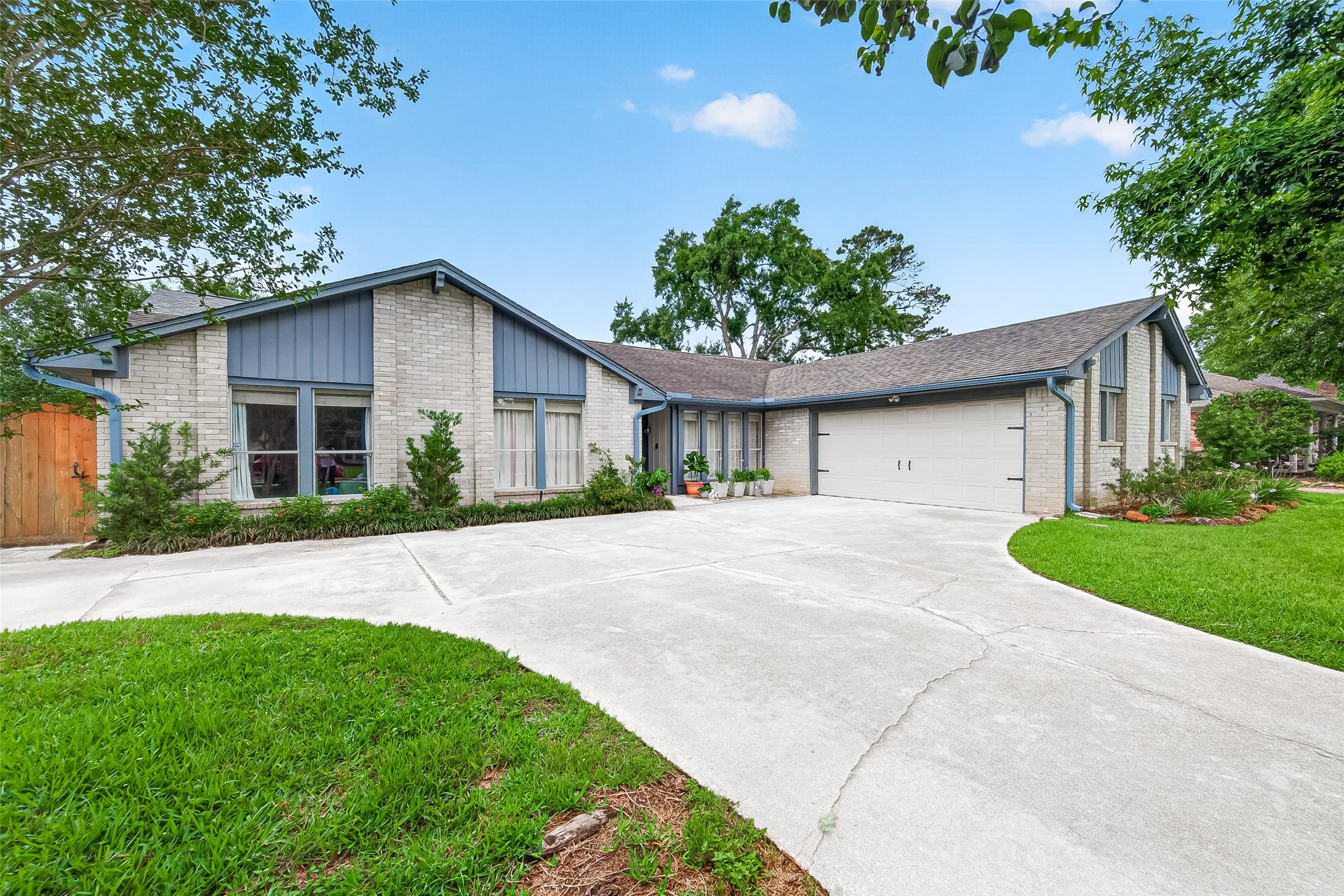17611 Sorrell Ridge Drive Spring, TX 77388 - Photo 2 of 50 a front view of a house with a garden and plants