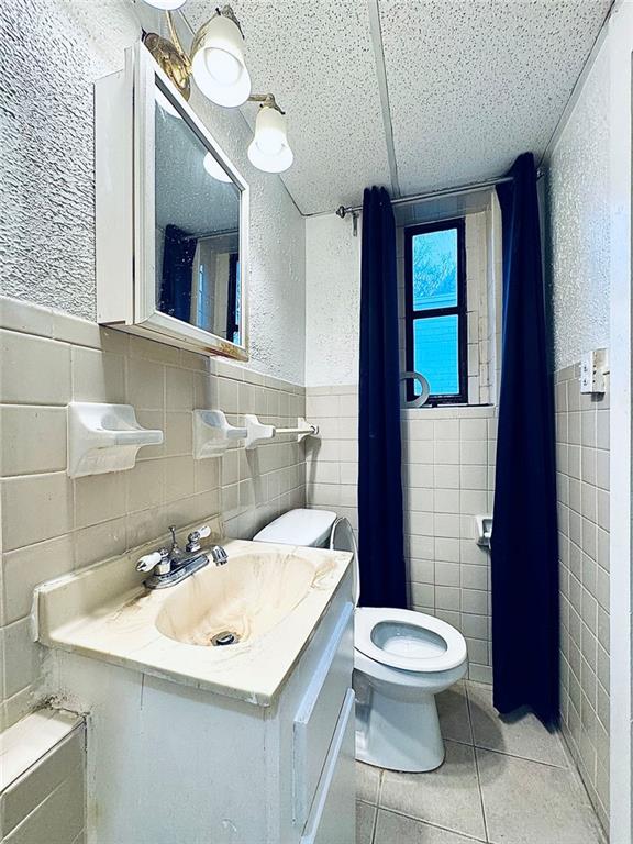 1447 Oxford Road Northeast Atlanta, GA 30307 - Photo 5 of 8 a bathroom with a sink toilet and mirror