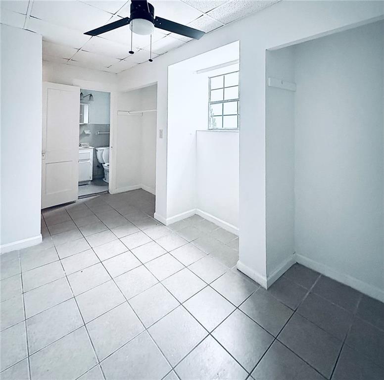 1447 Oxford Road Northeast Atlanta, GA 30307 - Photo 7 of 8 a view of an empty room with a window