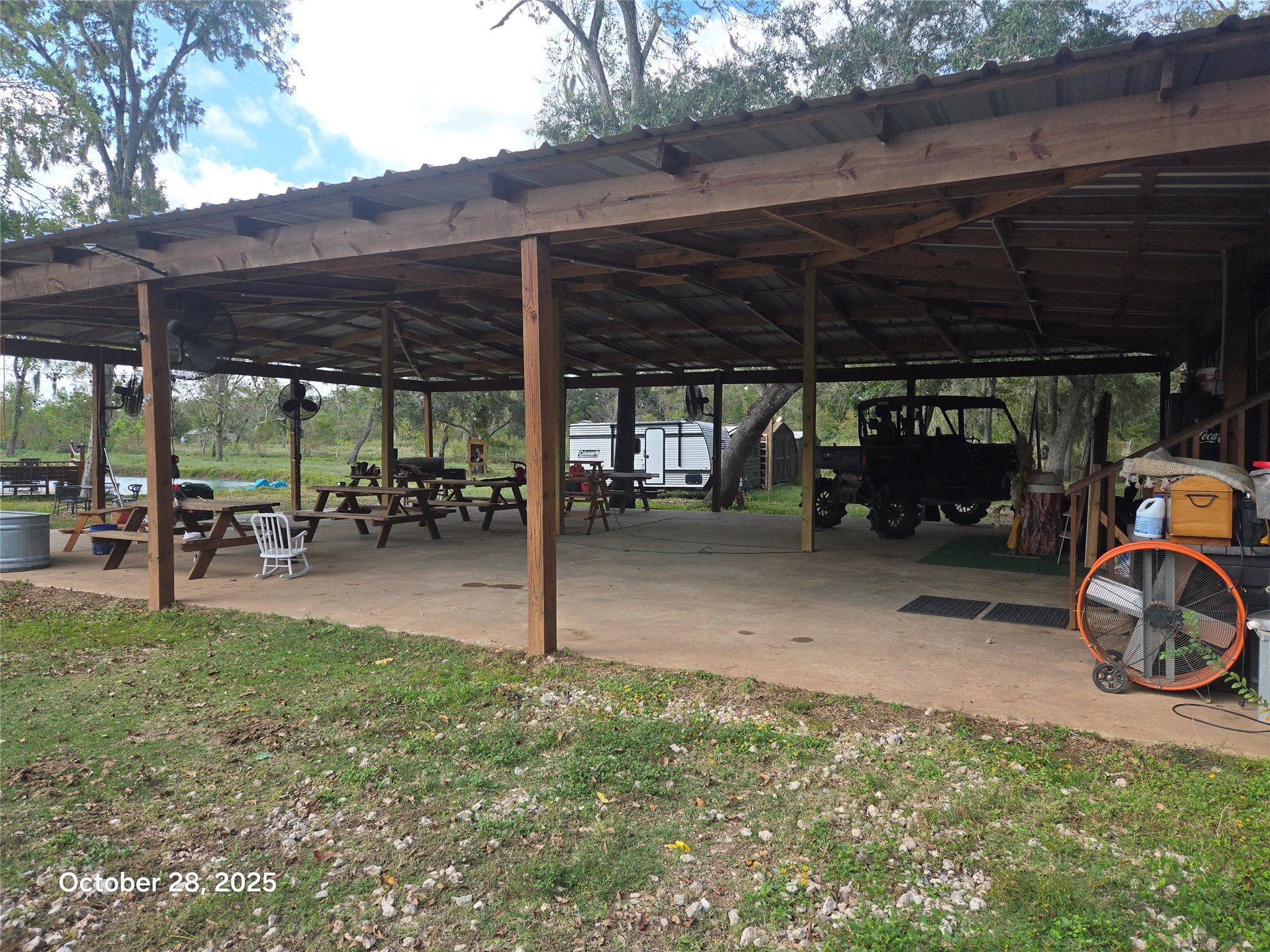 4915 West Farm To Market 1462 Rosharon, TX 77583 - Photo 3 of 17 a view of a patio with table and chairs under an umbrella