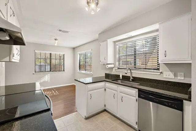 a kitchen with sink and window