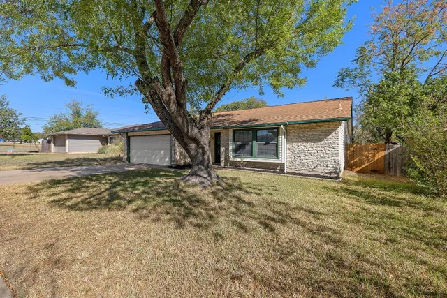a house with trees in front of it