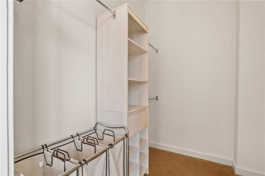 507 Sabine Street, Unit 705 Austin, TX 78701 - Photo 14 of 32 a view of walk in closet with empty racks
