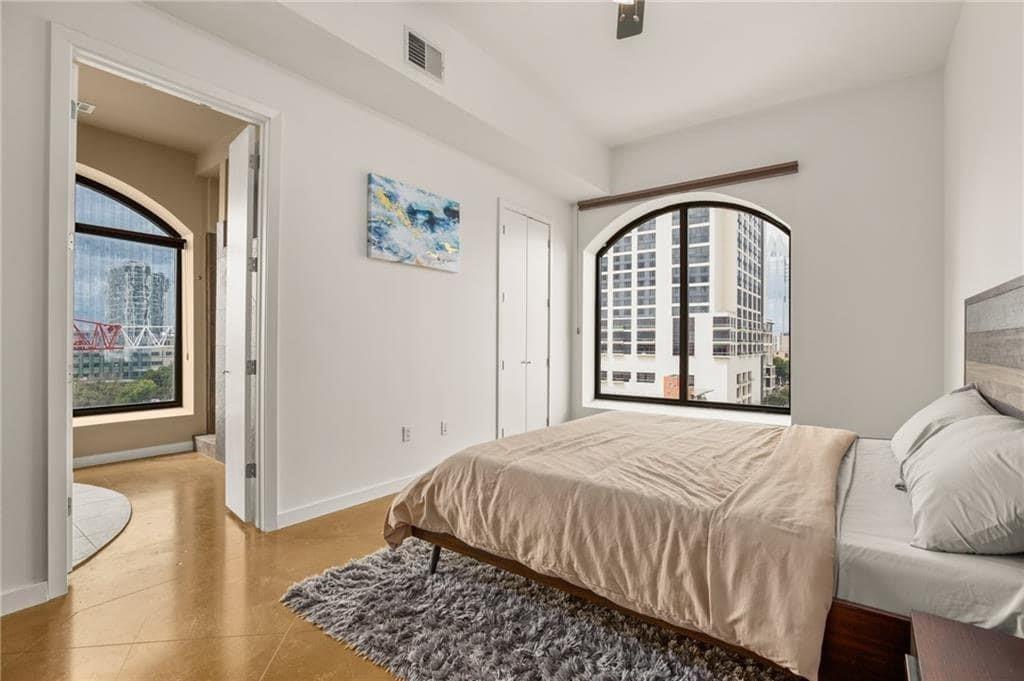 507 Sabine Street, Unit 705 Austin, TX 78701 - Photo 6 of 32 a bedroom with a bed and a window