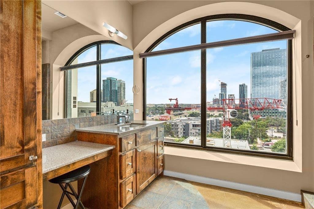 507 Sabine Street, Unit 705 Austin, TX 78701 - Photo 9 of 32 a dining room with a large window and table