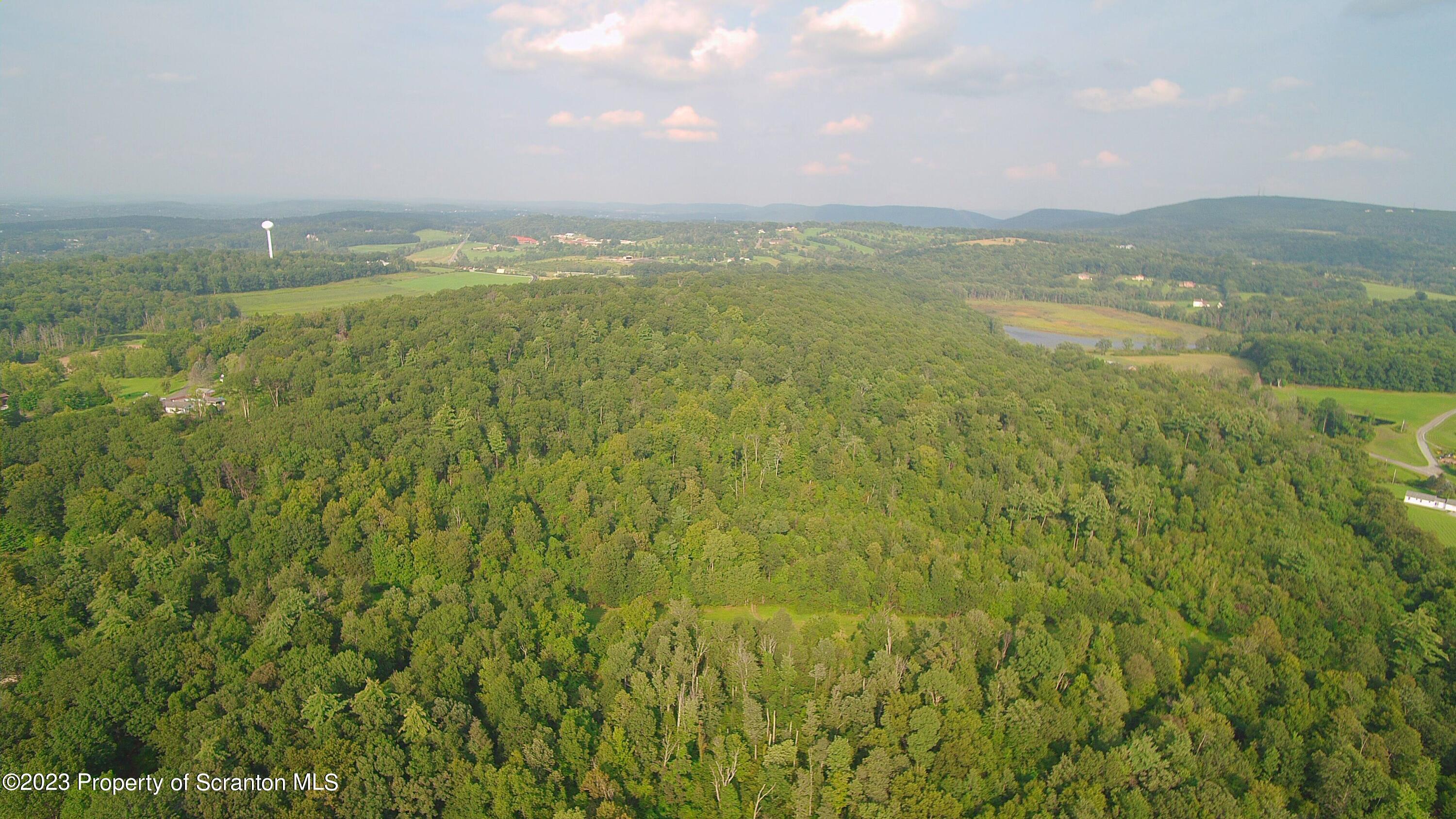 a view of an ocean and a mountain