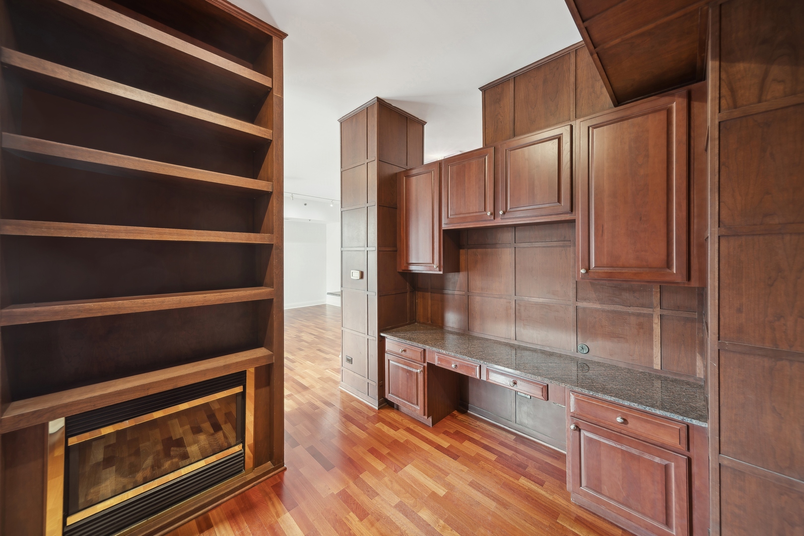 230 West Division Street, Unit 501 Chicago, IL 60610 - Photo 15 of 27 a kitchen with wooden cabinets and a stove top oven