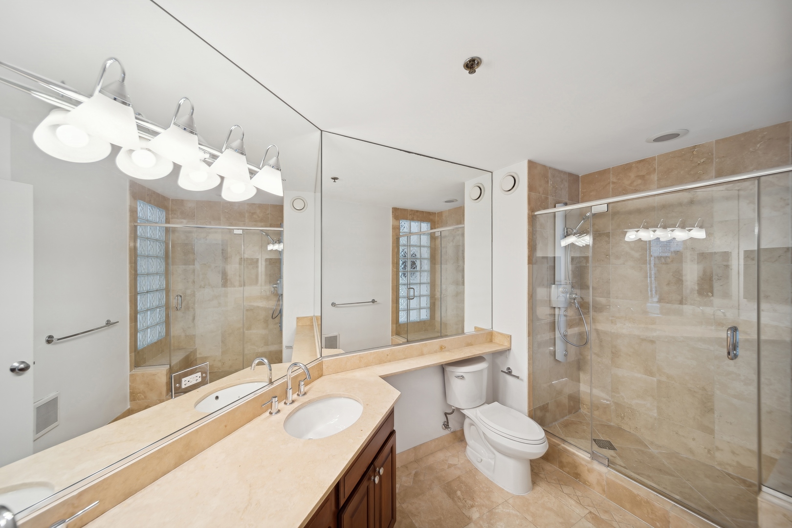 230 West Division Street, Unit 501 Chicago, IL 60610 - Photo 19 of 27 a bathroom with a sink a toilet and shower