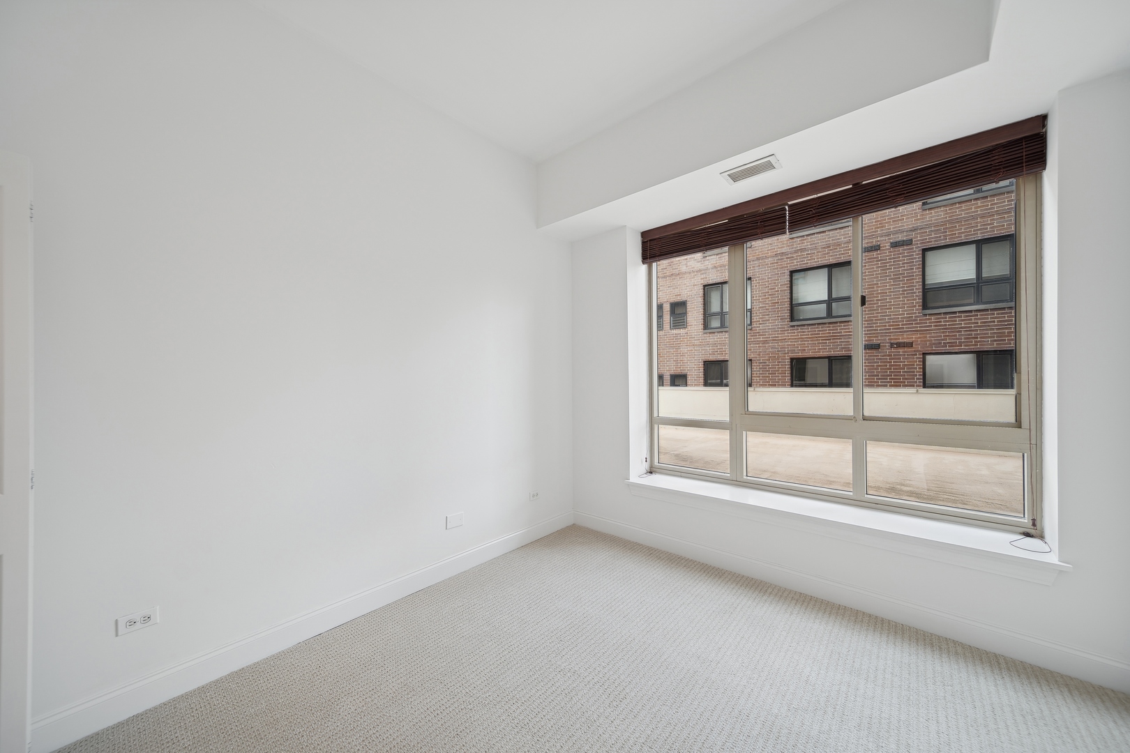 230 West Division Street, Unit 501 Chicago, IL 60610 - Photo 20 of 27 a view of an empty room with a window