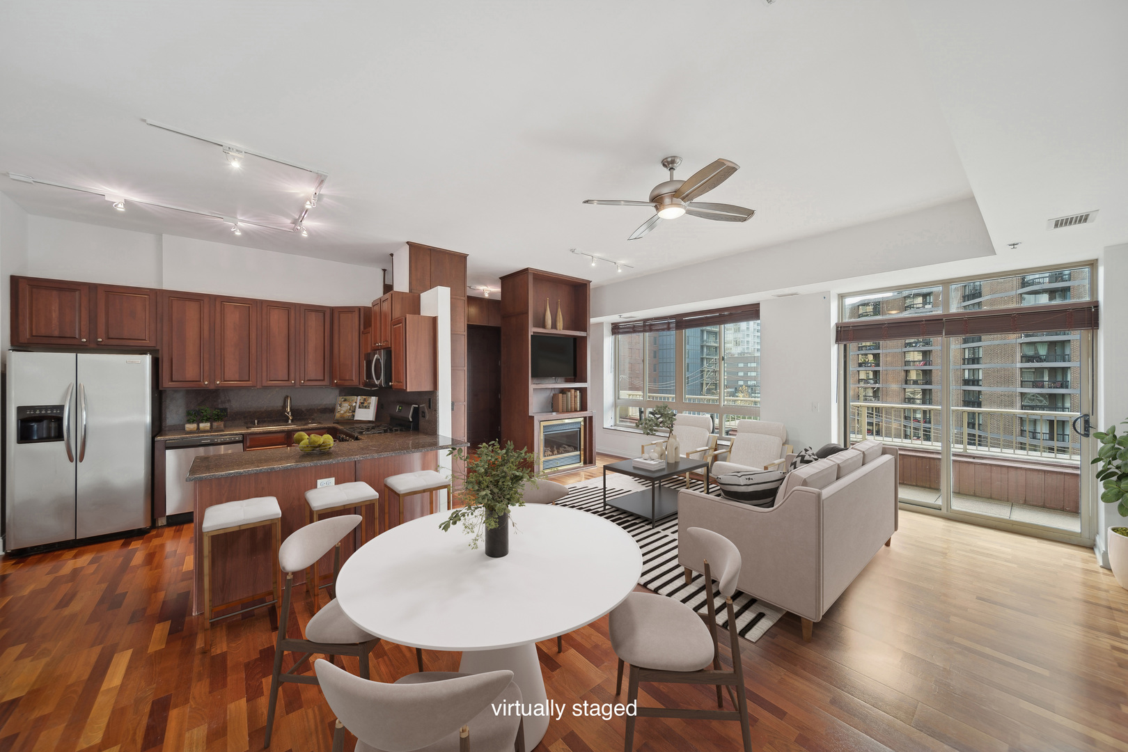 230 West Division Street, Unit 501 Chicago, IL 60610 - Photo 7 of 27 a living room with furniture kitchen view and a large window