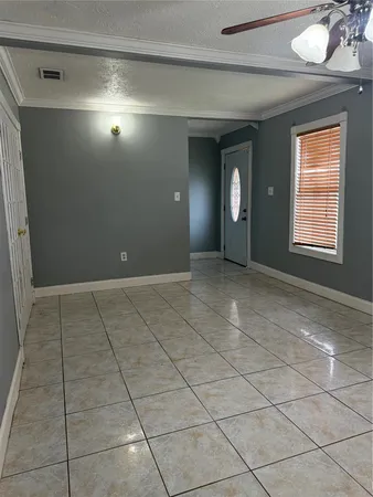a view of an empty room with a window