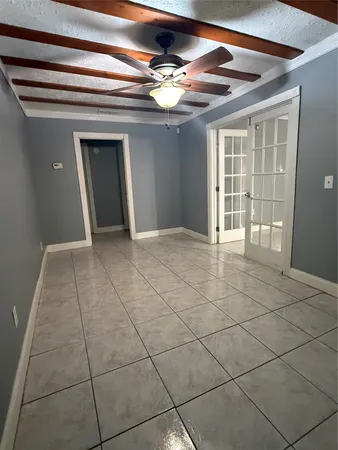 a view of an empty room and window