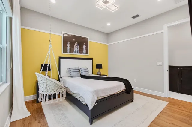 a view of a patio with table and chairs with wooden floor and fence