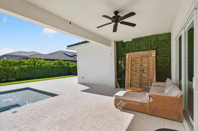 a living room with furniture a flat screen tv and a table