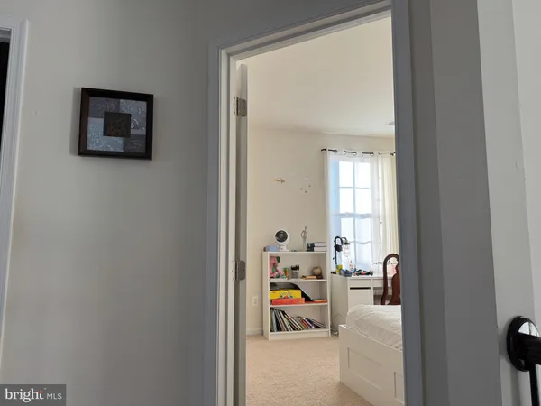a bed room with furniture and a window