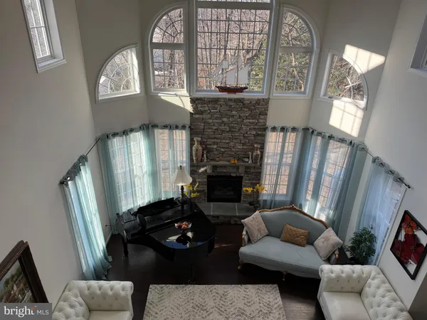 a living room with furniture fireplace and a flat screen tv