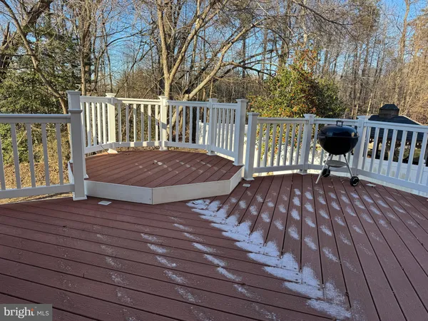 a view of balcony with deck and wooden floor