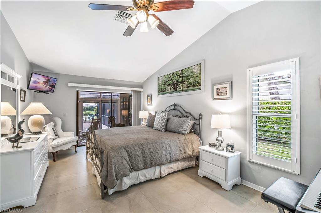 2232 Buckingham Lane Naples, FL 34112 - Photo 13 of 30 a bedroom with a bed and window