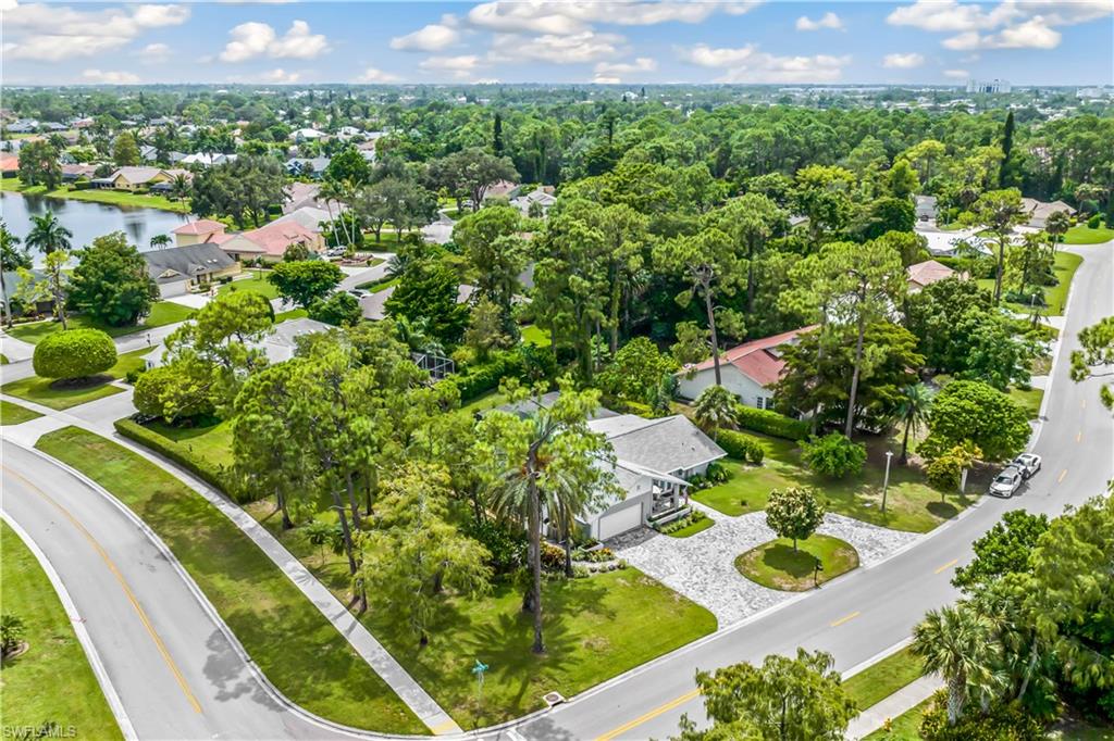 2232 Buckingham Lane Naples, FL 34112 - Photo 26 of 30 a view of a garden with a flower garden